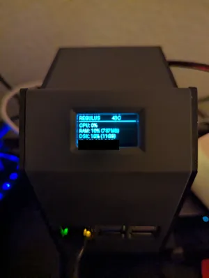 OLED showing system info — CPU, RAM, disk, IP